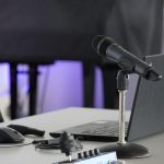 Laptop, conference table, mouse — "Stars By The Harbour: A Glimpse Into Its Premier Housing Features"